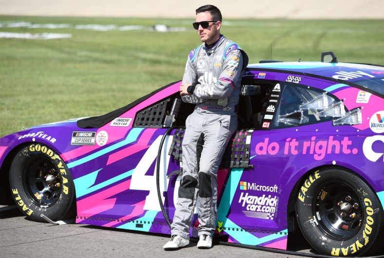 Jun 20, 2021; Nashville, Tennessee, USA; NASCAR Cup Series driver Alex Bowman (48) stands beside his car before qualifying for the Ally 400 at Nashville Superspeedway. Mandatory Credit: Christopher Hanewinckel-USA TODAY Sports