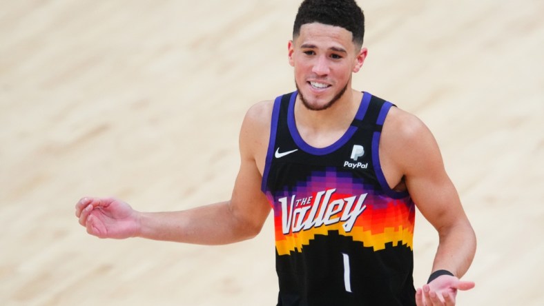Jun 20, 2021; Phoenix, Arizona, USA; Phoenix Suns guard Devin Booker reacts against the Los Angeles Clippers in the second half during game one of the Western Conference Finals for the 2021 NBA Playoffs at Phoenix Suns Arena. Mandatory Credit: Mark J. Rebilas-USA TODAY Sports