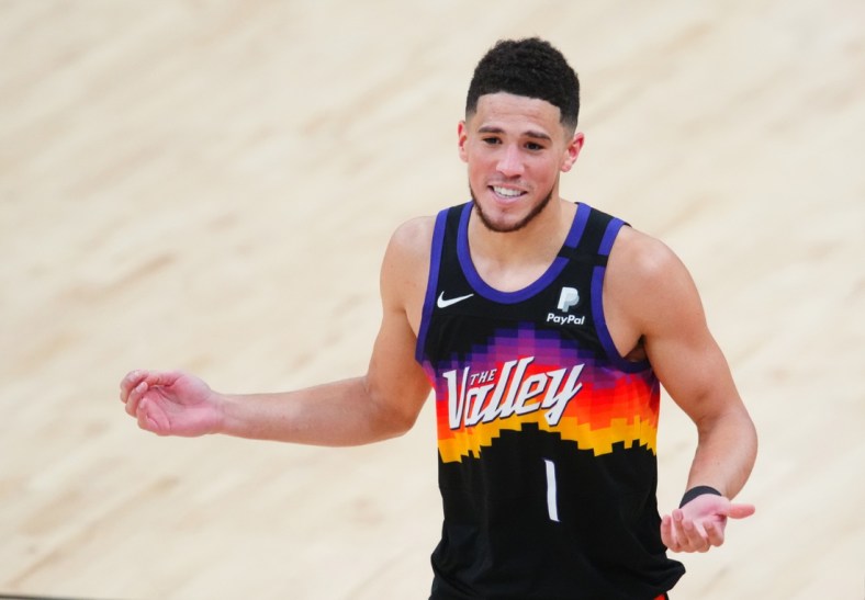 Jun 20, 2021; Phoenix, Arizona, USA; Phoenix Suns guard Devin Booker reacts against the Los Angeles Clippers in the second half during game one of the Western Conference Finals for the 2021 NBA Playoffs at Phoenix Suns Arena. Mandatory Credit: Mark J. Rebilas-USA TODAY Sports