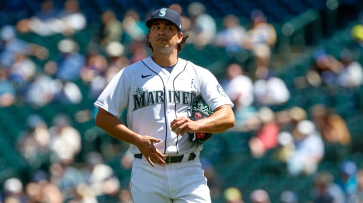 Jun 20, 2021; Seattle, Washington, USA; Seattle Mariners starting pitcher Marco Gonzales (7) reacts after putting two men on base against the Tampa Bay Rays during the fourth inning at T-Mobile Park. Mandatory Credit: Jennifer Buchanan-USA TODAY Sports