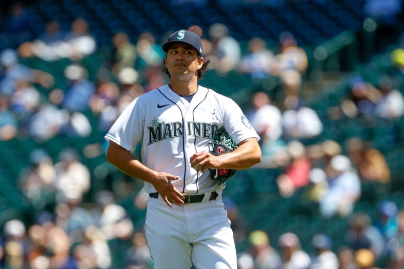 Jun 20, 2021; Seattle, Washington, USA; Seattle Mariners starting pitcher Marco Gonzales (7) reacts after putting two men on base against the Tampa Bay Rays during the fourth inning at T-Mobile Park. Mandatory Credit: Jennifer Buchanan-USA TODAY Sports