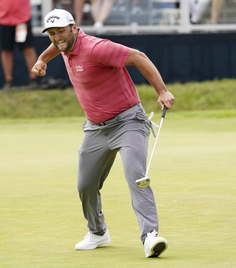 Jun 20, 2021; San Diego, California, USA; Jon Rahm reacts to his birdie putt on the 18th green during the final round of the U.S. Open golf tournament at Torrey Pines Golf Course. Mandatory Credit: Michael Madrid-USA TODAY Sports