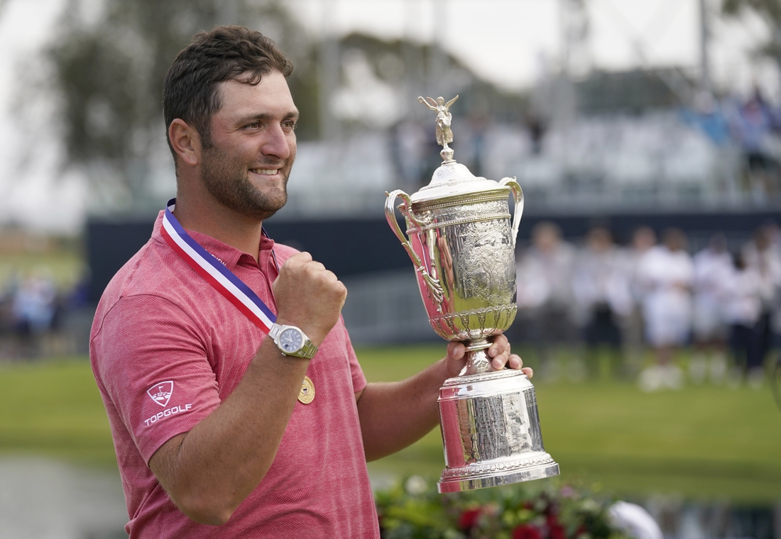 Jun 20, 2021; San Diego, California, USA; Jon Rahm celebrates with the trophy after winning he U.S. Open golf tournament at Torrey Pines Golf Course. Mandatory Credit: Michael Madrid-USA TODAY Sports