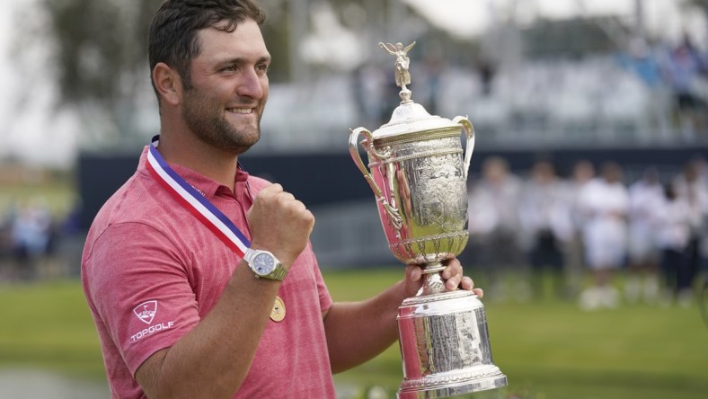 Jun 20, 2021; San Diego, California, USA; Jon Rahm celebrates with the trophy after winning he U.S. Open golf tournament at Torrey Pines Golf Course. Mandatory Credit: Michael Madrid-USA TODAY Sports