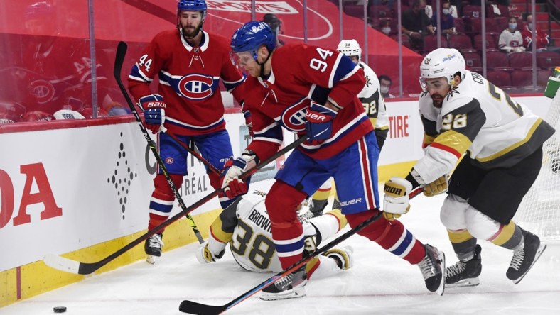 Jun 20, 2021; Montreal, Quebec, CAN; Montreal Canadiens forward Corey Perry (94) plays the puck and Vegas Golden Knights goalie Marc-Andre Fleury (29) forechecks during the first period in game four of the 2021 Stanley Cup Semifinals at the Bell Centre. Mandatory Credit: Eric Bolte-USA TODAY Sports