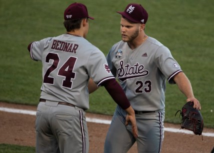 Mississippi St. pitcher Will Bednar (24) hugs relief pitcher Landon Sims (23) after Sims replaced Bednar in the seventh inning against Texas during game 4 in the NCAA Men   s College World Series at TD Ameritrade Park Sunday, June 20, 2021 in Omaha, Neb.

Nas Miss St Texas 028
