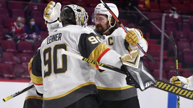 Jun 20, 2021; Montreal, Quebec, CAN; Vegas Golden Knights goalie Robin Lehner (90) and forward Mark Stone (61) celebrate the win against the Montreal Canadiens in game four of the 2021 Stanley Cup Semifinals at the Bell Centre. Mandatory Credit: Eric Bolte-USA TODAY Sports