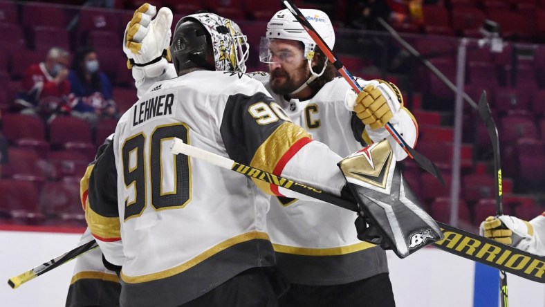 Jun 20, 2021; Montreal, Quebec, CAN; Vegas Golden Knights goalie Robin Lehner (90) and forward Mark Stone (61) celebrate the win against the Montreal Canadiens in game four of the 2021 Stanley Cup Semifinals at the Bell Centre. Mandatory Credit: Eric Bolte-USA TODAY Sports