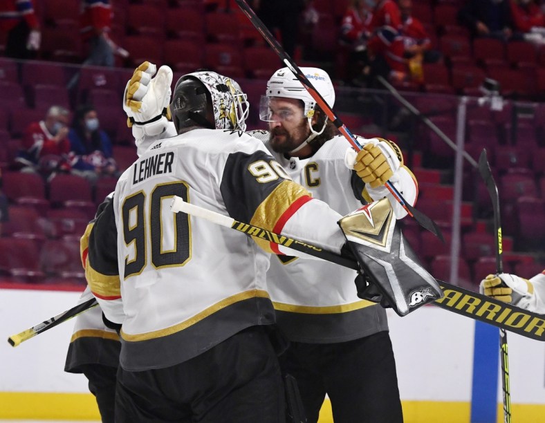 Jun 20, 2021; Montreal, Quebec, CAN; Vegas Golden Knights goalie Robin Lehner (90) and forward Mark Stone (61) celebrate the win against the Montreal Canadiens in game four of the 2021 Stanley Cup Semifinals at the Bell Centre. Mandatory Credit: Eric Bolte-USA TODAY Sports