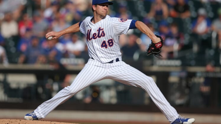 Jun 21, 2021; New York City, New York, USA; New York Mets starting pitcher Jacob deGrom (48) pitches against the Atlanta Braves during the third inning at Citi Field. Mandatory Credit: Brad Penner-USA TODAY Sports
