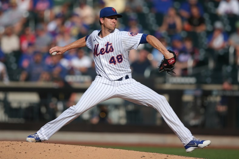 Jun 21, 2021; New York City, New York, USA; New York Mets starting pitcher Jacob deGrom (48) pitches against the Atlanta Braves during the third inning at Citi Field. Mandatory Credit: Brad Penner-USA TODAY Sports