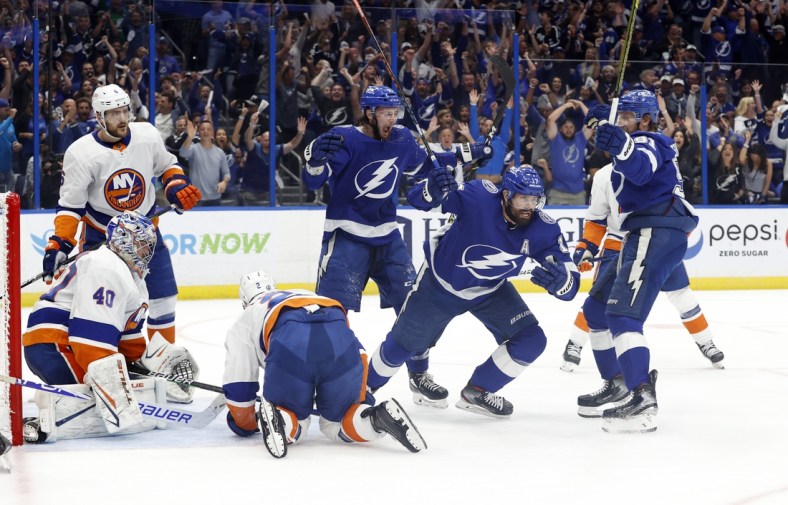 Jun 21, 2021; Tampa, Florida, USA; Tampa Bay Lightning left wing Alex Killorn (17) is congratulated by center Anthony Cirelli (71) and  center Steven Stamkos (91) as he scores a goal against the New York Islanders during the first period in game five of the Stanley Cup Semifinals at Amalie Arena. Mandatory Credit: Kim Klement-USA TODAY Sports