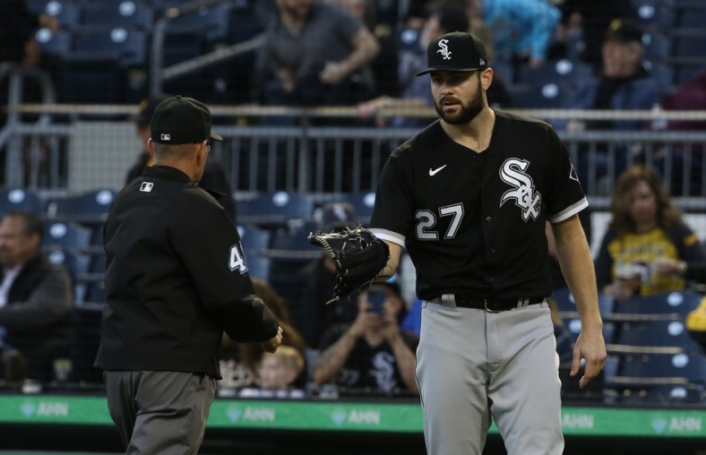 Jun 22, 2021; Pittsburgh, Pennsylvania, USA;  Umpire Jerry Meals (41) checks the glove of Chicago White Sox starting pitcher Lucas Giolito (27) for foreign substances after Giolito pitched the fifth inning against the Pittsburgh Pirates at PNC Park. Mandatory Credit: Charles LeClaire-USA TODAY Sports