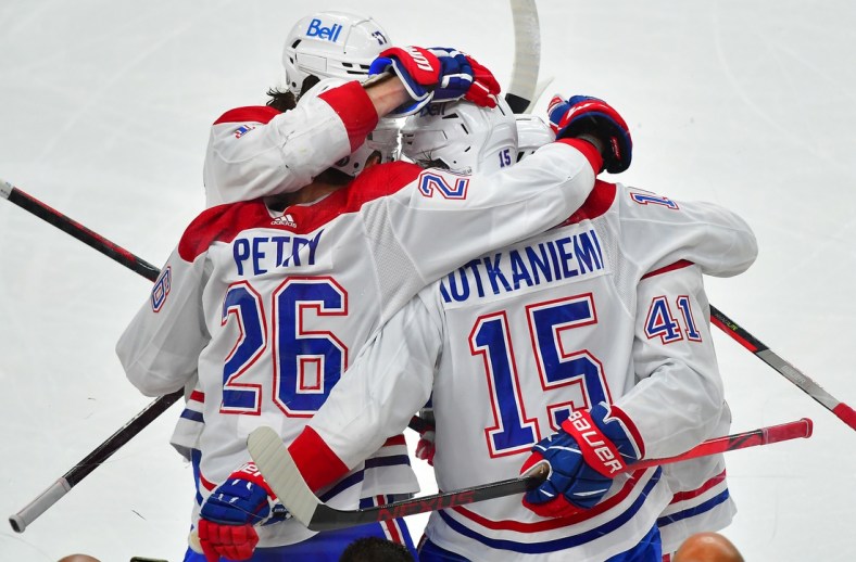 Jun 22, 2021; Las Vegas, Nevada, USA; Montreal Canadiens center Jesperi Kotkaniemi (15) celebrates with teammates after scoring a first period goal against the Vegas Golden Knights in game five of the 2021 Stanley Cup Semifinals at T-Mobile Arena. Mandatory Credit: Stephen R. Sylvanie-USA TODAY Sports