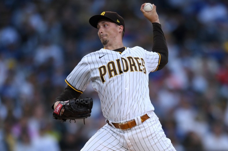 Jun 22, 2021; San Diego, California, USA; San Diego Padres starting pitcher Blake Snell (4) throws a pitch against the Los Angeles Dodgers during the first inning at Petco Park. Mandatory Credit: Orlando Ramirez-USA TODAY Sports