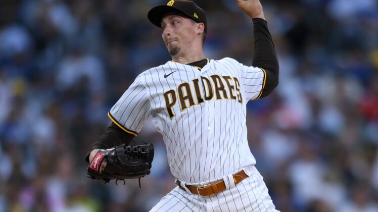 Jun 22, 2021; San Diego, California, USA; San Diego Padres starting pitcher Blake Snell (4) throws a pitch against the Los Angeles Dodgers during the first inning at Petco Park. Mandatory Credit: Orlando Ramirez-USA TODAY Sports