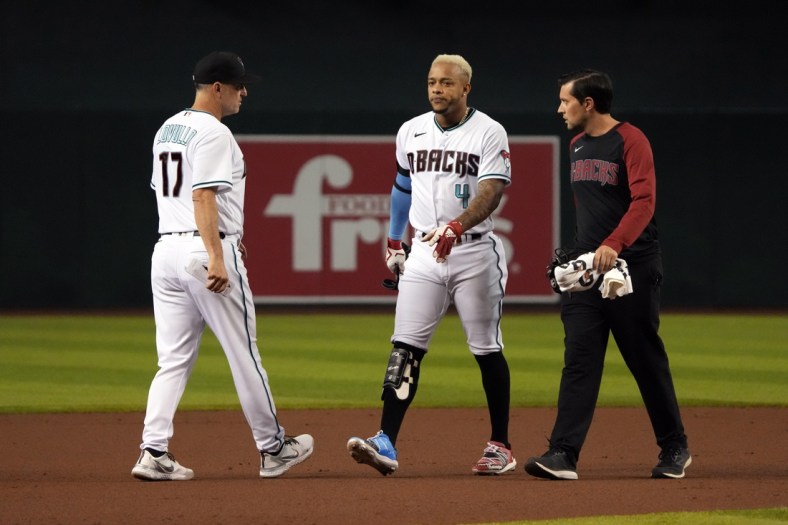Jun 22, 2021; Phoenix, Arizona, USA; Arizona Diamondbacks second baseman Ketel Marte (4) leaves the game after hitting a double against the Milwaukee Brewers in the first inning at Chase Field. Mandatory Credit: Rick Scuteri-USA TODAY Sports