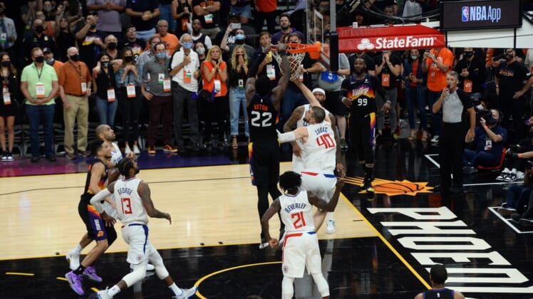 Jun 22, 2021; Phoenix, Arizona, USA; Phoenix Suns center Deandre Ayton (22) dunks over LA Clippers center Ivica Zubac (40) in the final second during the second half of game two of the Western Conference Finals for the 2021 NBA Playoffs at Phoenix Suns Arena. Mandatory Credit: Joe Camporeale-USA TODAY Sports