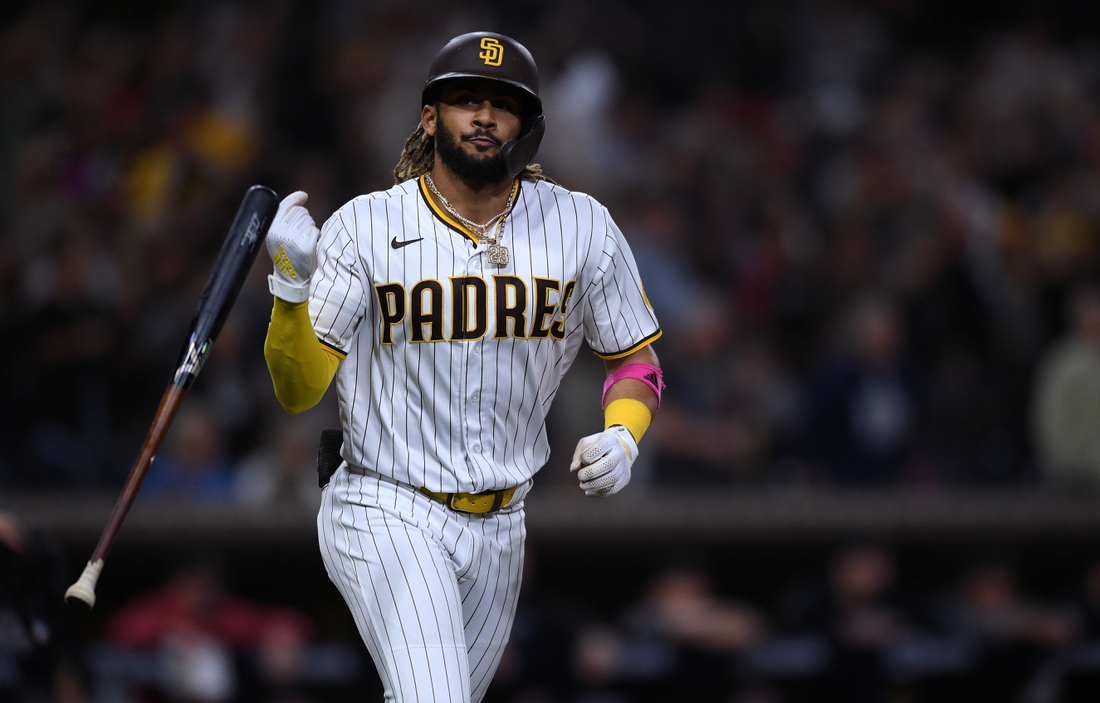 Jun 25, 2021; San Diego, California, USA; San Diego Padres shortstop Fernando Tatis Jr. (23) flips his bat after hitting a two-run home run against the Arizona Diamondbacks during the fourth inning at Petco Park. Mandatory Credit: Orlando Ramirez-USA TODAY Sports