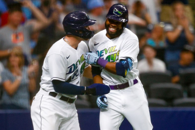 Jun 26, 2021; St. Petersburg, Florida, USA;  Tampa Bay Rays designated hitter Austin Meadows (17) congratulates  right fielder Manuel Margot (13) after hitting a two run home run in the second inning against the Los Angeles Angels Tropicana Field. Mandatory Credit: Nathan Ray Seebeck-USA TODAY Sports
