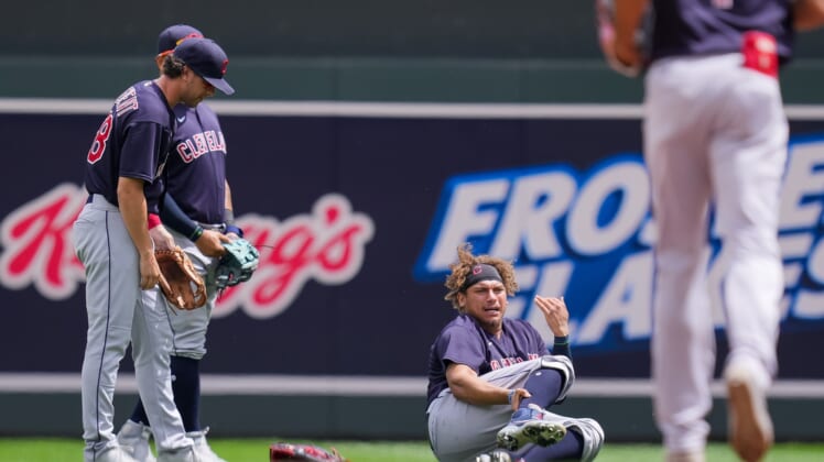 Jun 27, 2021; Minneapolis, Minnesota, USA; Cleveland Indians outfielder Josh Naylor (22) calls for medial attention after colliding with  second baseman Ernie Clement (28) in the fourth innings against the Minnesota Twins  at Target Field. Mandatory Credit: Brad Rempel-USA TODAY Sports
