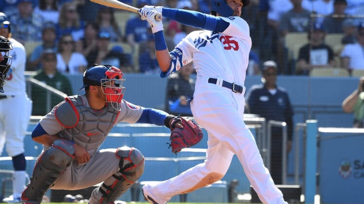 Jun 27, 2021; Los Angeles, California, USA;   Los Angeles Dodgers center fielder Cody Bellinger (35) hits a two run home run off of Chicago Cubs starting pitcher Adbert Alzolay (73) in the second inning of the game at Dodger Stadium. Mandatory Credit: Jayne Kamin-Oncea-USA TODAY Sports