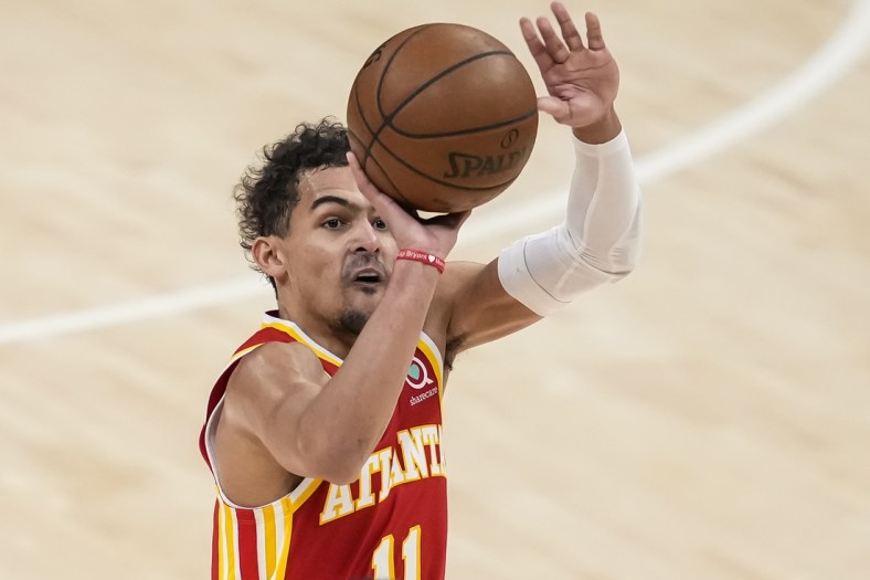 Jun 27, 2021; Atlanta, Georgia, USA; Atlanta Hawks guard Trae Young (11) shoots a three point shot against the Milwaukee Bucks during the first quarter during game three of the Eastern Conference Finals for the 2021 NBA Playoffs at State Farm Arena. Mandatory Credit: Dale Zanine-USA TODAY Sports