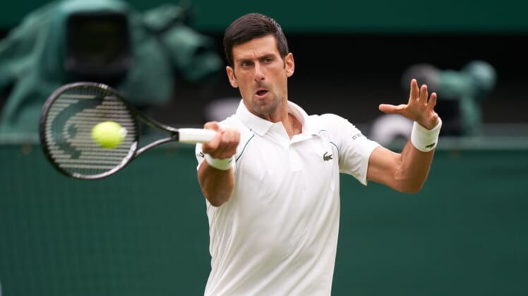 Jun 28, 2021; London, United Kingdom;  Novak Djokovic (SRB) seen playing against Jack Draper (GBR) on the centre court in the first round at All England Lawn Tennis and Croquet Club. Mandatory Credit: Peter van den Berg-USA TODAY Sports
