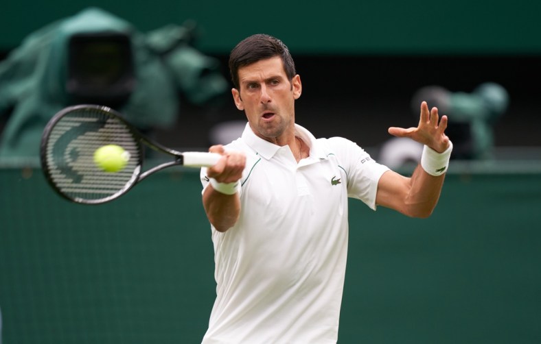 Jun 28, 2021; London, United Kingdom;  Novak Djokovic (SRB) seen playing against Jack Draper (GBR) on the centre court in the first round at All England Lawn Tennis and Croquet Club. Mandatory Credit: Peter van den Berg-USA TODAY Sports
