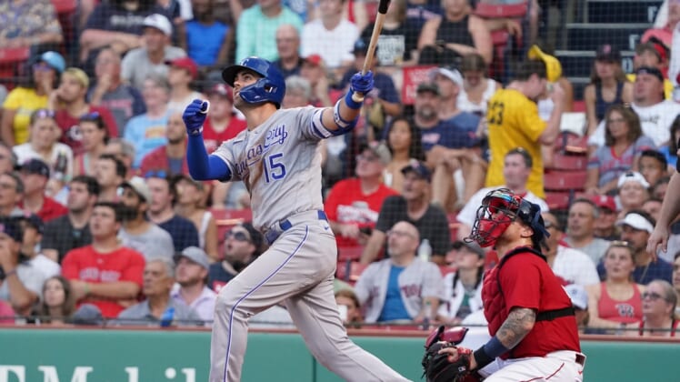 Jun 28, 2021; Boston, Massachusetts, USA; Kansas City Royals right fielder Whit Merrifield (15) hits a home run against the Boston Red Sox during the second inning at Fenway Park. Mandatory Credit: David Butler II-USA TODAY Sports