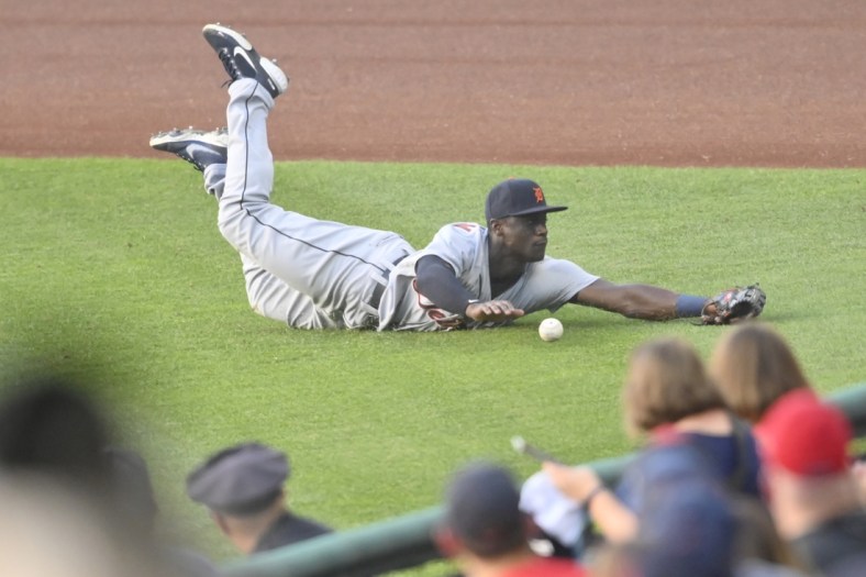 Jun 28, 2021; Cleveland, Ohio, USA; Detroit Tigers right fielder Daz Cameron (41) dives for a double by Cleveland Indians right fielder Harold Ramirez (40) in the second inning at Progressive Field. Mandatory Credit: David Richard-USA TODAY Sports
