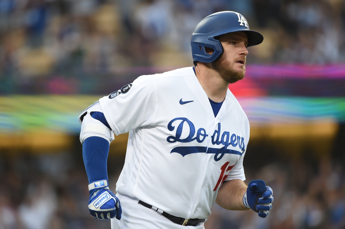 Jun 28, 2021; Los Angeles, California, USA; Los Angeles Dodgers first baseman Max Muncy (13) runs after hitting a solo home run in the first inning against the San Francisco Giants at Dodger Stadium. Mandatory Credit: Richard Mackson-USA TODAY Sports