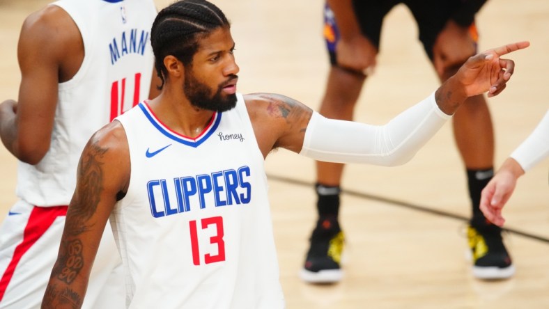 Jun 28, 2021; Phoenix, Arizona, USA; Los Angeles Clippers guard Paul George (13) against the Phoenix Suns in the first half during game five of the Western Conference Finals for the 2021 NBA Playoffs at Phoenix Suns Arena. Mandatory Credit: Mark J. Rebilas-USA TODAY Sports