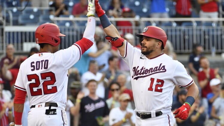 Jun 29, 2021; Washington, District of Columbia, USA; Washington Nationals left fielder Kyle Schwarber (12) is congratulated by left fielder Juan Soto (22) after hitting a solo home run during the first inning at Nationals Park. Mandatory Credit: Brad Mills-USA TODAY Sports