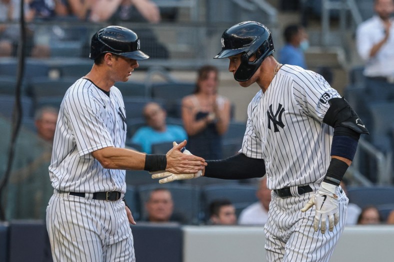 Jun 29, 2021; Bronx, New York, USA;  New York Yankees right fielder Aaron Judge (99) celebrates his two run home run with second baseman DJ LeMahieu (26) during the second inning against the Los Angeles Angels at Yankee Stadium. Mandatory Credit: Vincent Carchietta-USA TODAY Sports