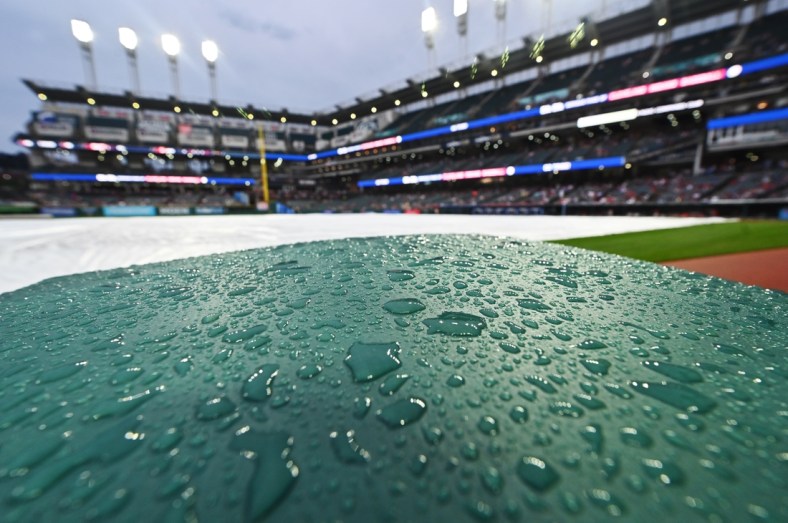 Jun 29, 2021; Cleveland, Ohio, USA; Rain collects on the protective barrier at at Progressive Field as the game between the Cleveland Indians and the Detroit Tigers is delayed. Mandatory Credit: Ken Blaze-USA TODAY Sports