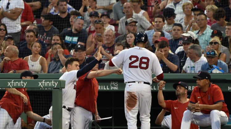 Jun 29, 2021; Boston, Massachusetts, USA; Boston Red Sox designated hitter J.D. Martinez (28) is greeted in the dugout after scoring a run during the third inning against the Kansas City Royals at Fenway Park. Mandatory Credit: Bob DeChiara-USA TODAY Sports
