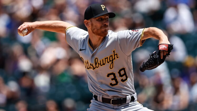 Jun 30, 2021; Denver, Colorado, USA; Pittsburgh Pirates starting pitcher Chad Kuhl (39) pitches in the first inning against the Colorado Rockies at Coors Field. Mandatory Credit: Isaiah J. Downing-USA TODAY Sports