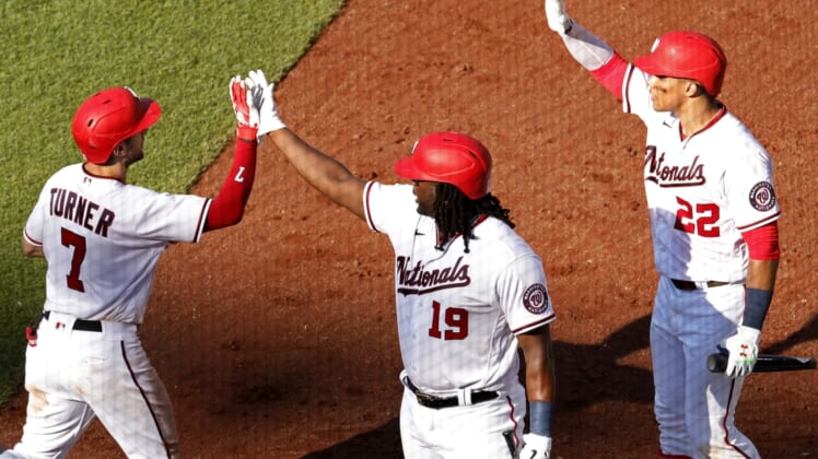 Jun 30, 2021; Washington, District of Columbia, USA; Washington Nationals shortstop Trea Turner (7) celebrates with Nationals first baseman Josh Bell (19) and Nationals left fielder Juan Soto (22) after hitting a home run against the Tampa Bay Rays in the fourth inning at Nationals Park. Mandatory Credit: Geoff Burke-USA TODAY Sports