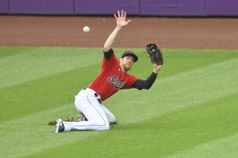 Jun 30, 2021; Cleveland, Ohio, USA; Cleveland Indians center fielder Bradley Zimmer (4) attempts to field a single hit by Detroit Tigers designated hitter Miguel Cabrera (not pictured) during the third inning at Progressive Field. Mandatory Credit: David Richard-USA TODAY Sports
