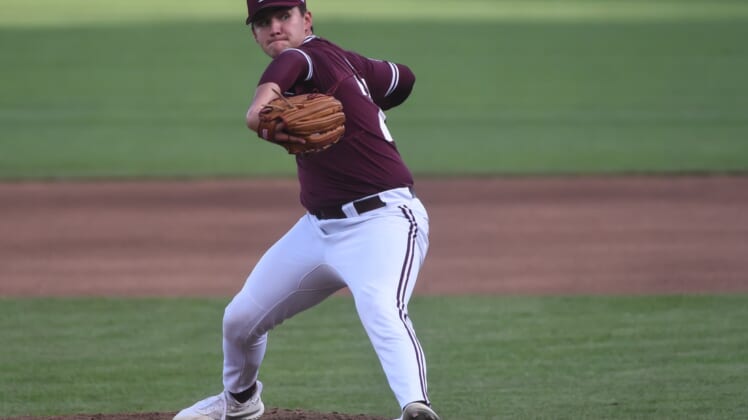 Jun 30, 2021; Omaha, Nebraska, USA;  Mississippi St. Bulldogs pitcher Will Bednar (24) pitches in the fourth inning against the Vanderbilt Commodores at TD Ameritrade Park. Mandatory Credit: Steven Branscombe-USA TODAY Sports