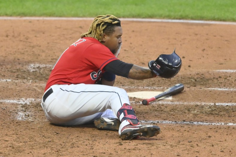 Jun 30, 2021; Cleveland, Ohio, USA; Cleveland Indians third baseman Jose Ramirez (11) reacts after he was hit in the face with a foul ball during the fifth inning against the Detroit Tigers at Progressive Field. Mandatory Credit: David Richard-USA TODAY Sports