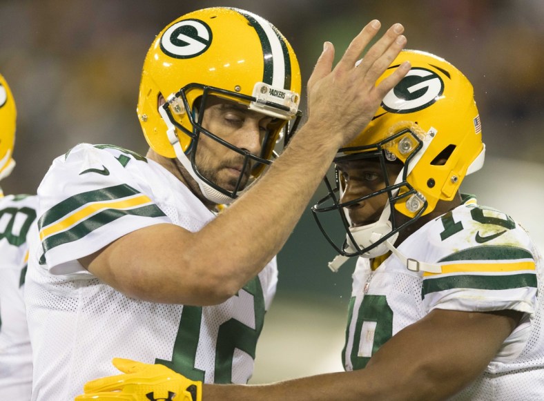 Sep 28, 2017; Green Bay, WI, USA; Green Bay Packers quarterback Aaron Rodgers (12) celebrates with wide receiver Randall Cobb (18) following a touchdown during the third quarter against the Chicago Bears at Lambeau Field. Mandatory Credit: Jeff Hanisch-USA TODAY Sports
