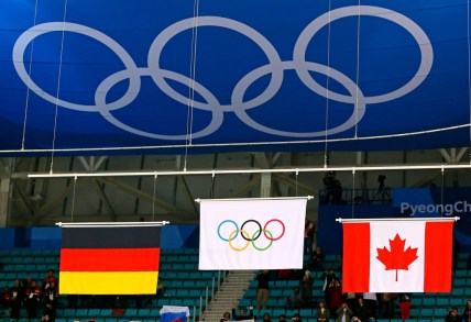 Feb 24, 2018; Gangneung, South Korea; The Olympic flag is raised for the Olympic Athletes from Russia after beating Germany in the men's ice hockey gold medal match during the Pyeongchang 2018 Olympic Winter Games at Gangneung Hockey Centre. Mandatory Credit: David E. Klutho-USA TODAY Sports