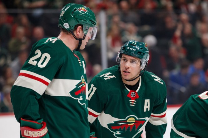 Feb 27, 2018; Saint Paul, MN, USA; Minnesota Wild forward Zach Parise (11) talks to defenseman Ryan Suter (20) in the first period against the St Louis Blues at Xcel Energy Center. Mandatory Credit: Brad Rempel-USA TODAY Sports