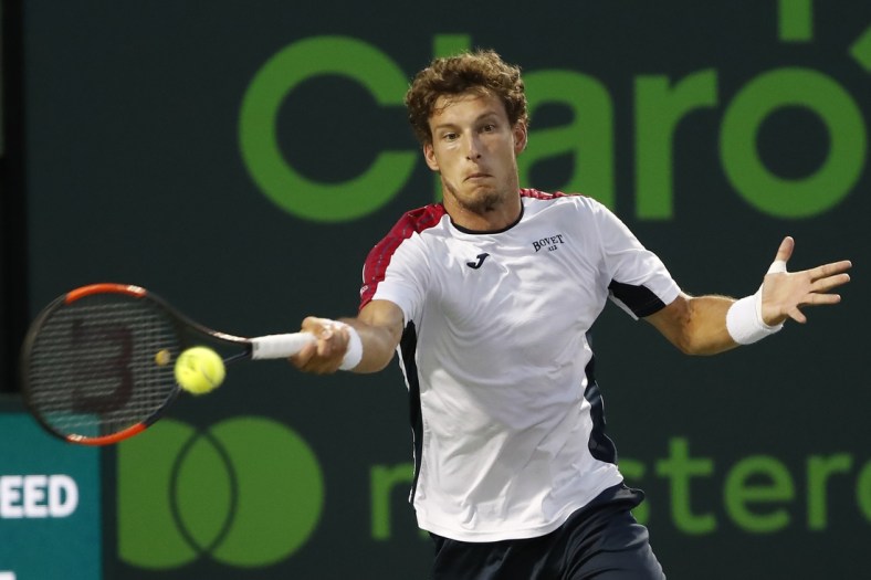 Mar 30, 2018; Key Biscayne, FL, USA; Pablo Carreno Busta of Spain his a forehand against Alexander Zverev of Germany (not pictured) in a men's singles semi-final of the Miami Open at Tennis Center at Crandon Park. Zverev won 6-4, 6-2. Mandatory Credit: Geoff Burke-USA TODAY Sports