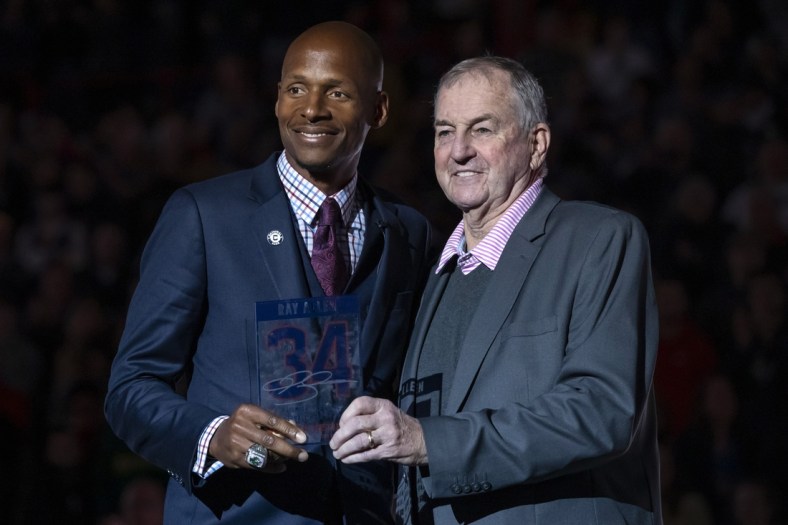 Mar 3, 2019; Storrs, CT, USA; Former Connecticut Huskies head coach Jim Calhoun (right) helps honor former Connecticut Huskies and Naismith Memorial Basketball Hall of Fame inductee Ray Allen with the retirement of his jersey number (34) during half time as the Huskies take on the South Florida Bulls at Gampel Pavilion. Allen is the second UConn player to have their number retired. Mandatory Credit: David Butler II-USA TODAY Sports