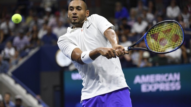 Aug 31, 2019; Flushing, NY, USA; Nick Kyrgios of Australia returns a shot against Andrey Rublev of Russia in a third round match on day six of the 2019 U.S. Open tennis tournament at USTA Billie Jean King National Tennis Center. Mandatory Credit: Danielle Parhizkaran-USA TODAY Sports