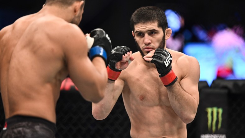 Sep 7, 2019; Abu Dhabi, UAE; Islam Makhachev (red gloves) fights Davi Ramos (blue gloves) during UFC 242 at The Arena. Mandatory Credit: Per Haljestam-USA TODAY Sports