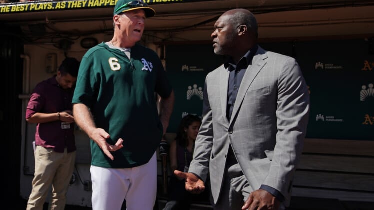 Sep 8, 2019; Oakland, CA, USA; Oakland Athletics manager Bob Melvin (6) talks to former pitcher Dave Stewart before the game against the Detroit Tigers at Oakland Coliseum. Mandatory Credit: Darren Yamashita-USA TODAY Sports